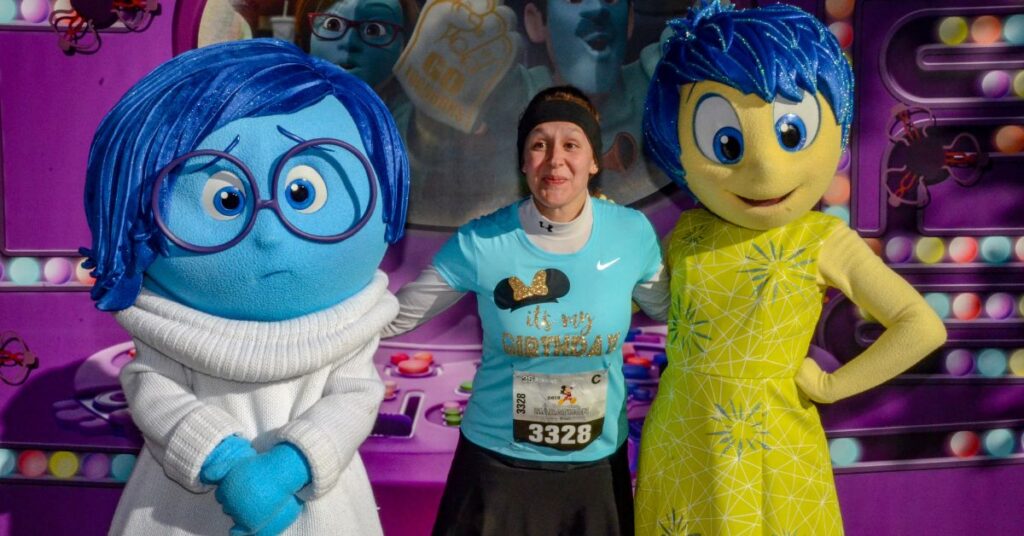 At the Walt Disney World Marathon, I'm standing with Joy and Sadness, the Disney characters. This is a great race for those wondering, "how long does it take to walk a marathon?"