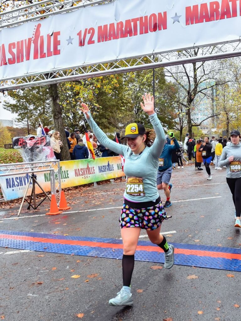I'm crossing the finish line of the Nashville Half Marathon wearing my CEP Compression calf sleeves. I prefer sleeves to the compression running socks because I prefer to wear Injinji toe socks.