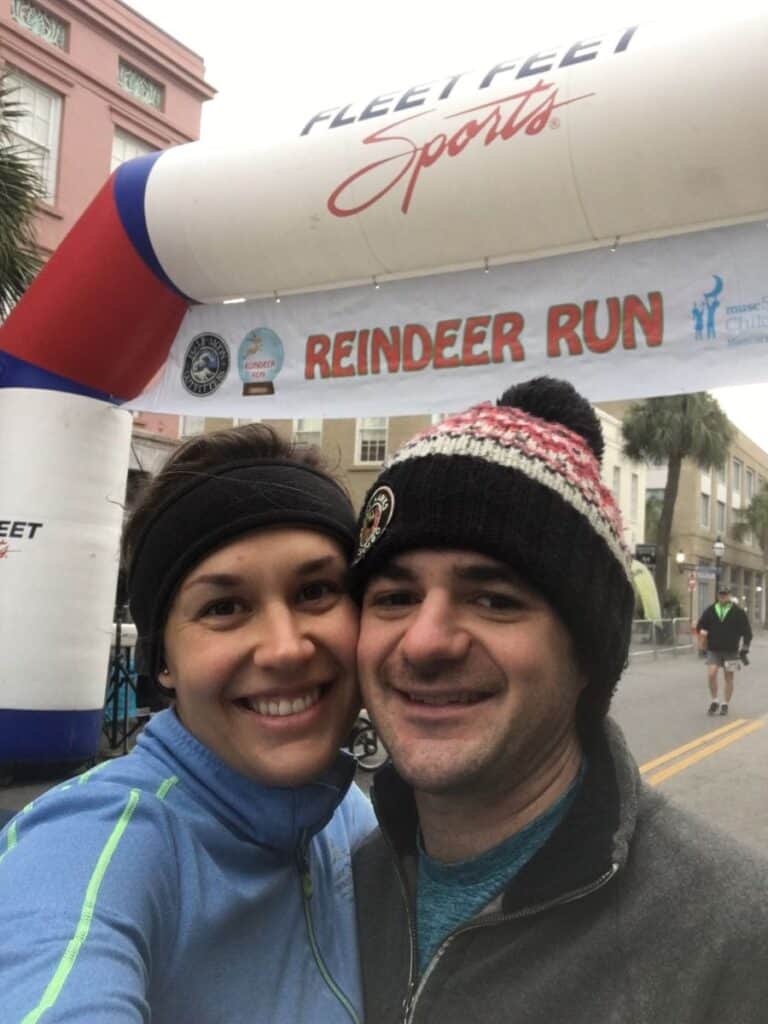 My boyfriend and I taking a selfie in front of the finish line at the Reindeer Run 5k in Charleston, South Carolina in December 2018.