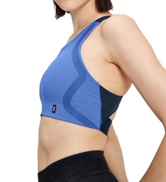 Cobalt/Navy ON Performance sports bra on a model from REI.